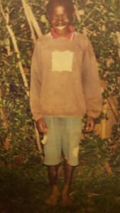 Jeremiah nyongesa malaba -- the first orphan child in  the project --  at nakhosi  home in 2003. (Pioneer ).