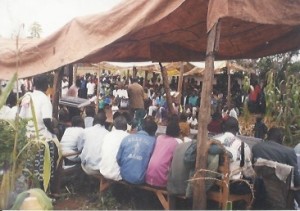 Bro Makona preaching in a rural village of Uganda